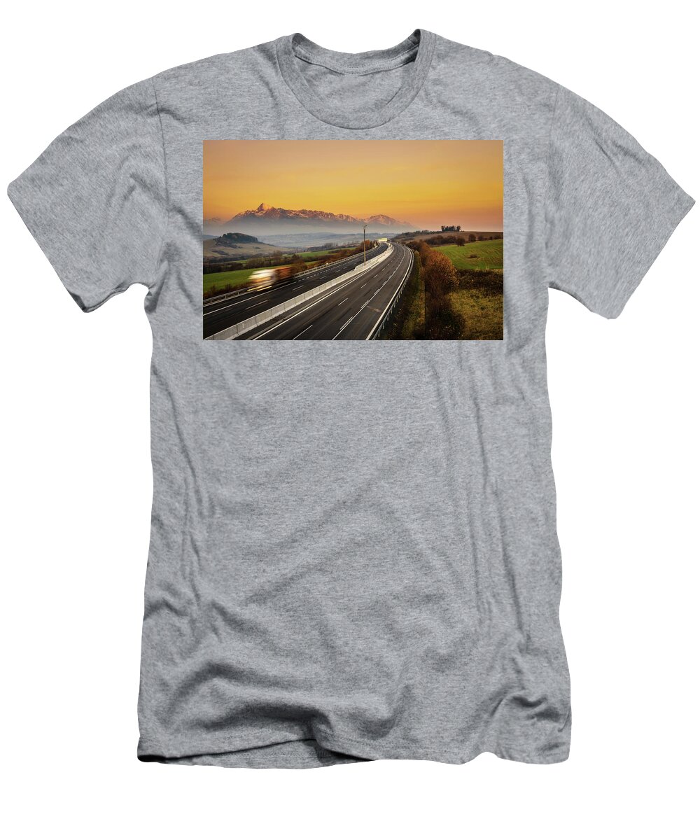 High Tatra T-Shirt featuring the photograph Highway with a truck under High Tatras in Slovakia by Miroslav Liska