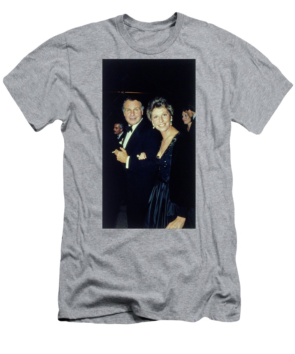 Fashion Designer T-Shirt featuring the photograph The Met Set Bill Blass and Geraldine Stutz by Tony Palmieri