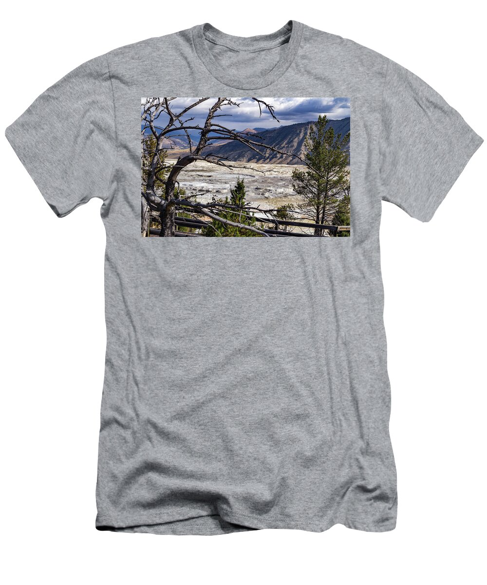 America T-Shirt featuring the photograph View of the travertine and mountains from the pathway at Mammoth Hot Springs by Roslyn Wilkins