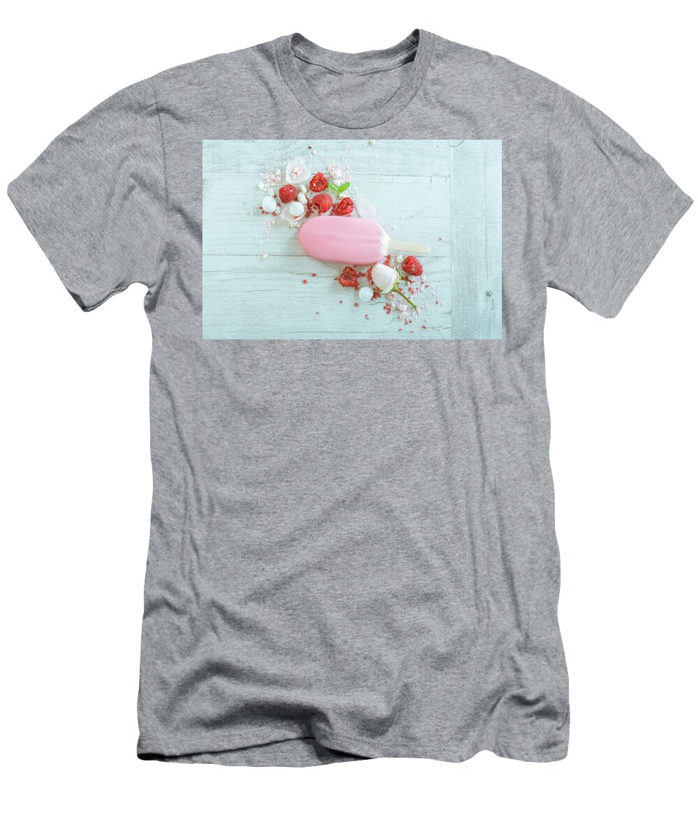 Background T-Shirt featuring the photograph Raspberries With Ice Cream In Pink Chocolate And White Petals Of Rose On Wooden Background #6 by Oleg Yermolov