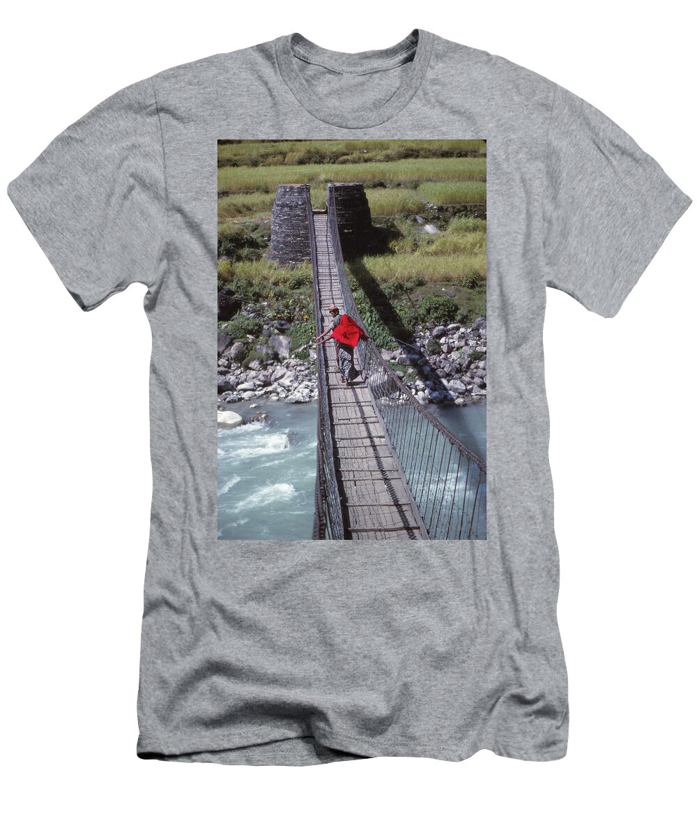 Nepal T-Shirt featuring the photograph Crossing a suspension bridge by Steve Estvanik