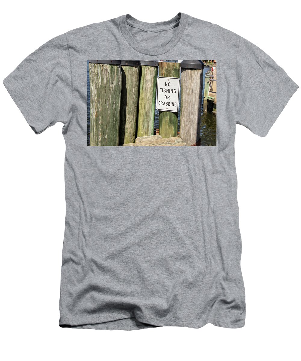 America T-Shirt featuring the photograph No fishing or crabbing sign by Karen Foley