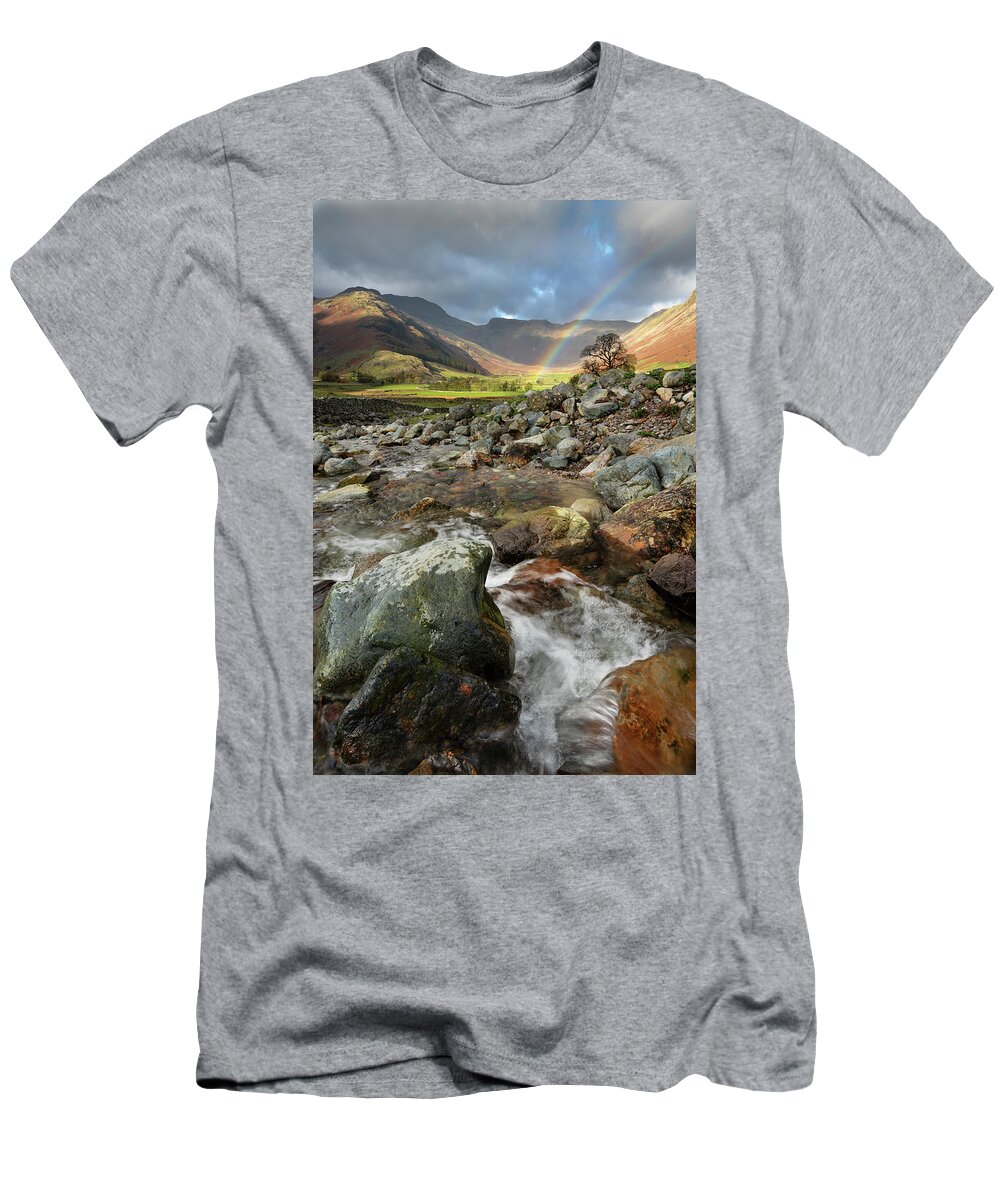 #lakedistrict #rainbow #water #mountains #clouds#thelakedistrict #cumbria #spashingrocks #vally #movingwater #fastwater #light #rainbows T-Shirt featuring the photograph Where the rainbow ends by John Chivers