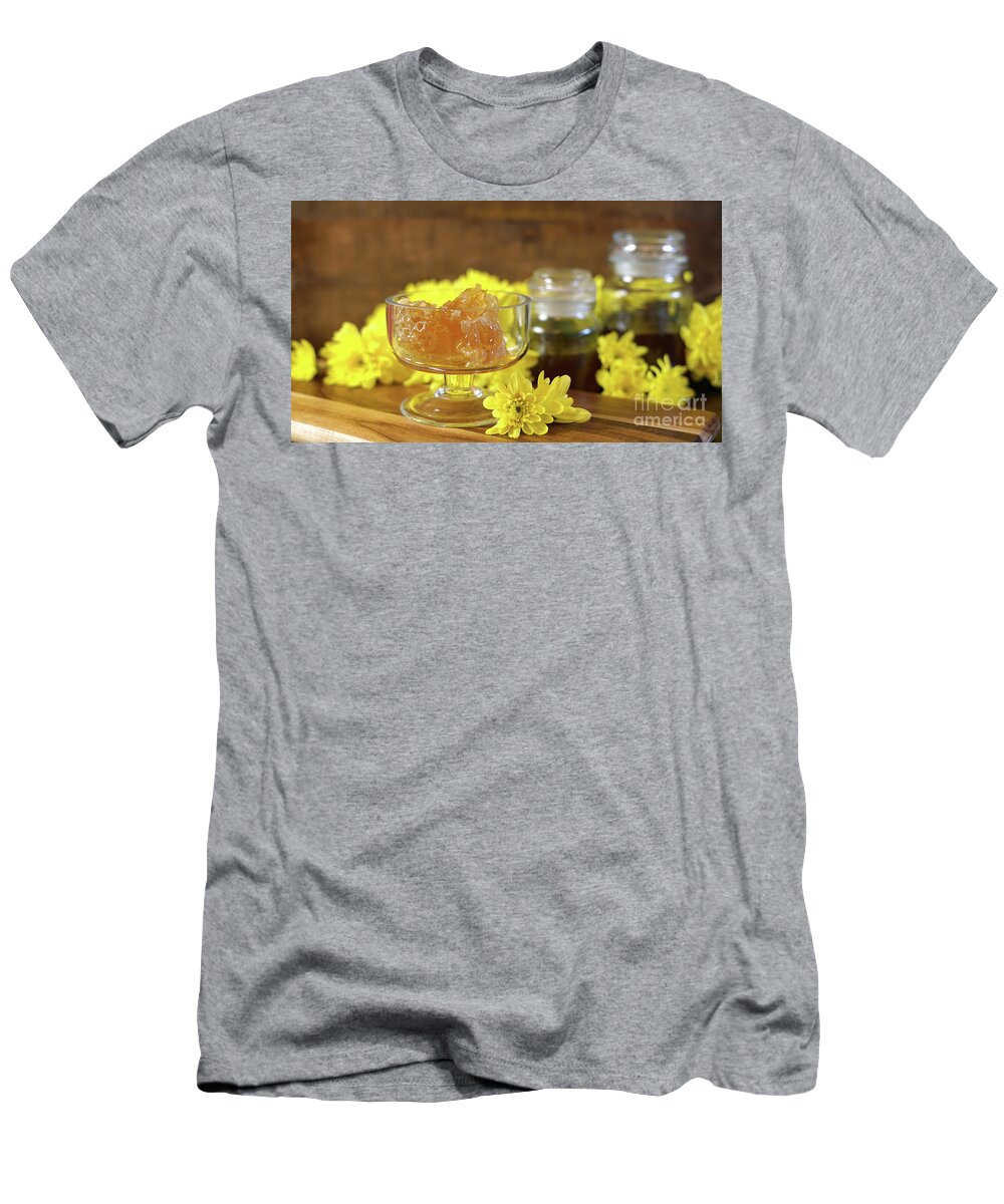 Honey T-Shirt featuring the photograph Raw honeycomb with liquid honey in glass jar with lavendar. #1 by Milleflore Images