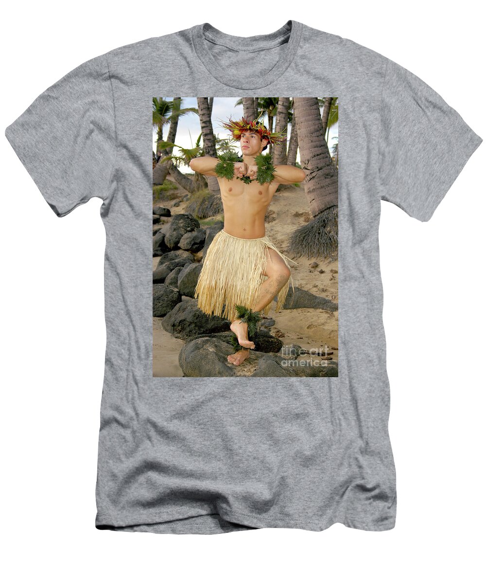 Male Hula Dancer T-Shirt featuring the photograph Male hula dancer poses in front of palm trees on the beach.	 by Gunther Allen