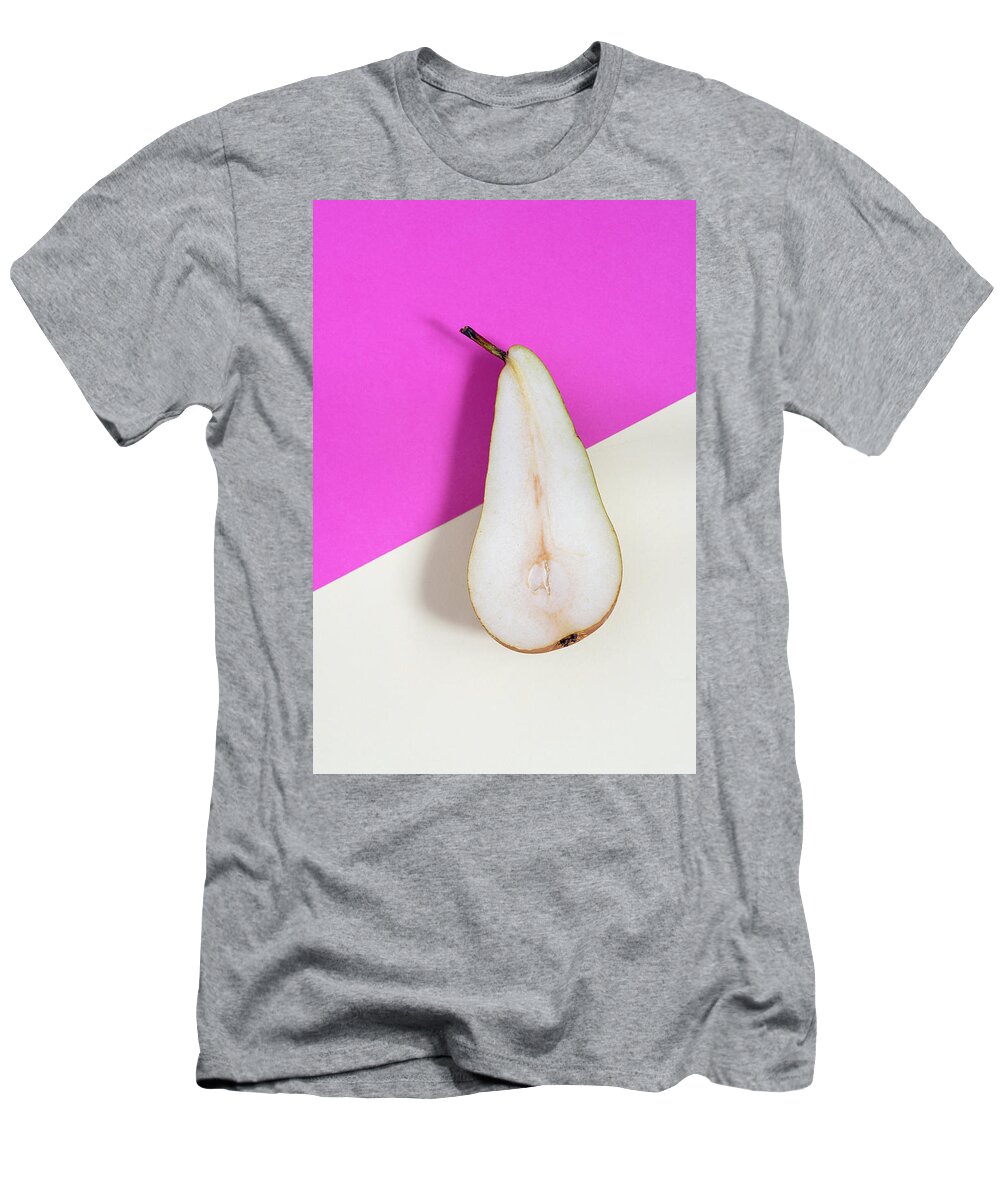 Still-life T-Shirt featuring the photograph Slice of healthy pear fruit on a colourful background. by Michalakis Ppalis