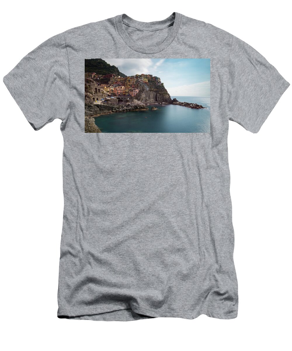 Cinque Terre T-Shirt featuring the photograph Village of Manarola with colourful houses at the edge of the cliff Riomaggiore, Cinque Terre, Liguria, Italy by Michalakis Ppalis