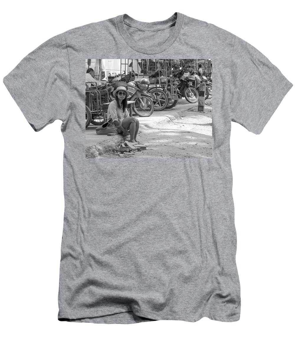 Bike T-Shirt featuring the photograph Waif - Poor destitute girl waiting for a lift sitting in the gut by Jeremy Holton