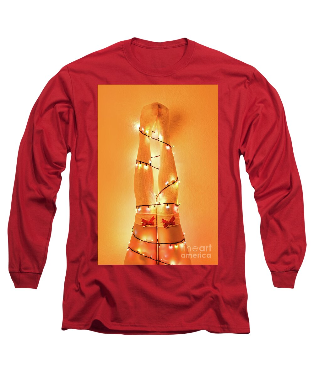 Christmas Long Sleeve T-Shirt featuring the photograph Female legs wrapped with christmas tree lights by Mendelex Photography