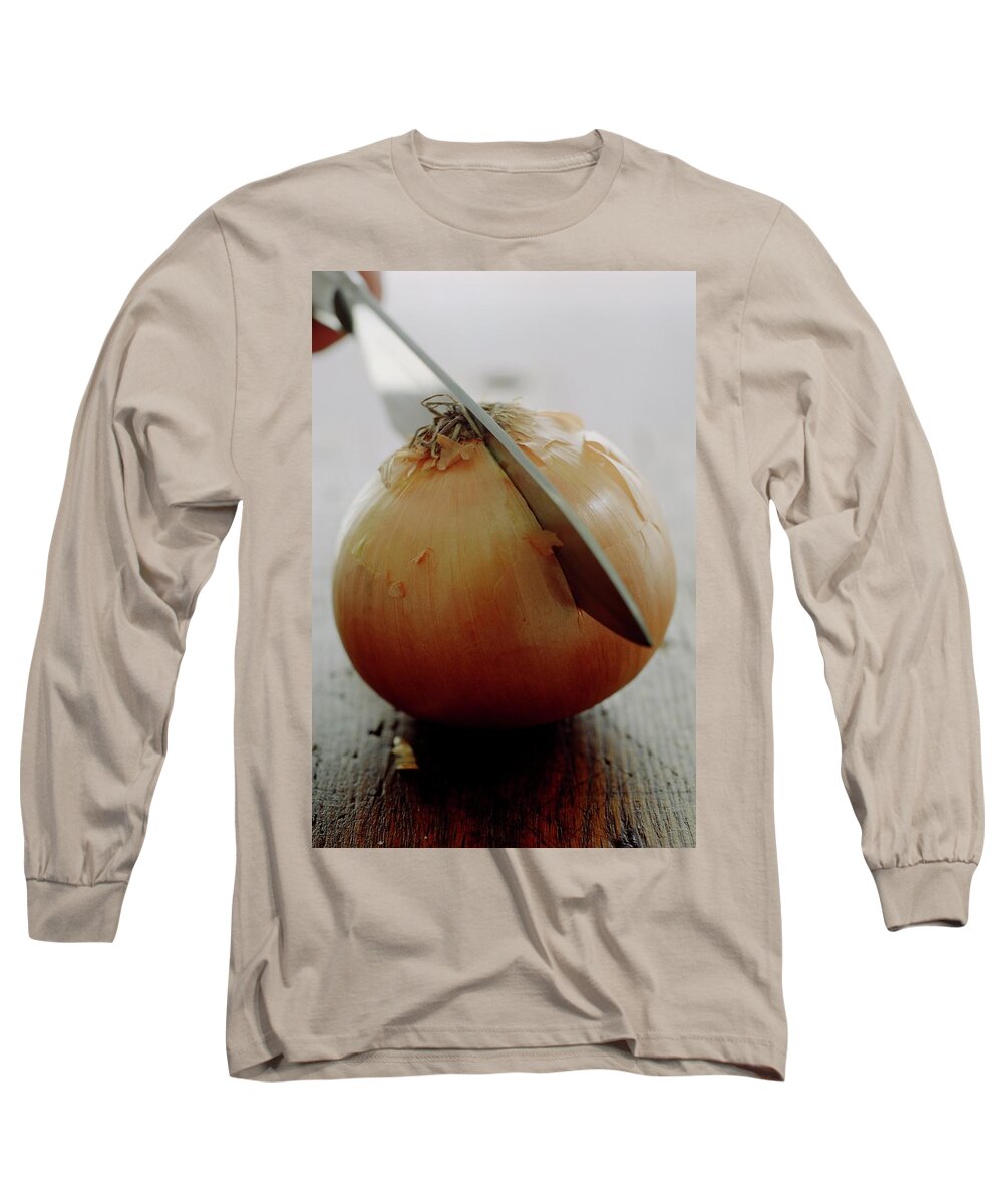 Fruits Long Sleeve T-Shirt featuring the photograph A Raw Onion Being Cut In Half by Romulo Yanes