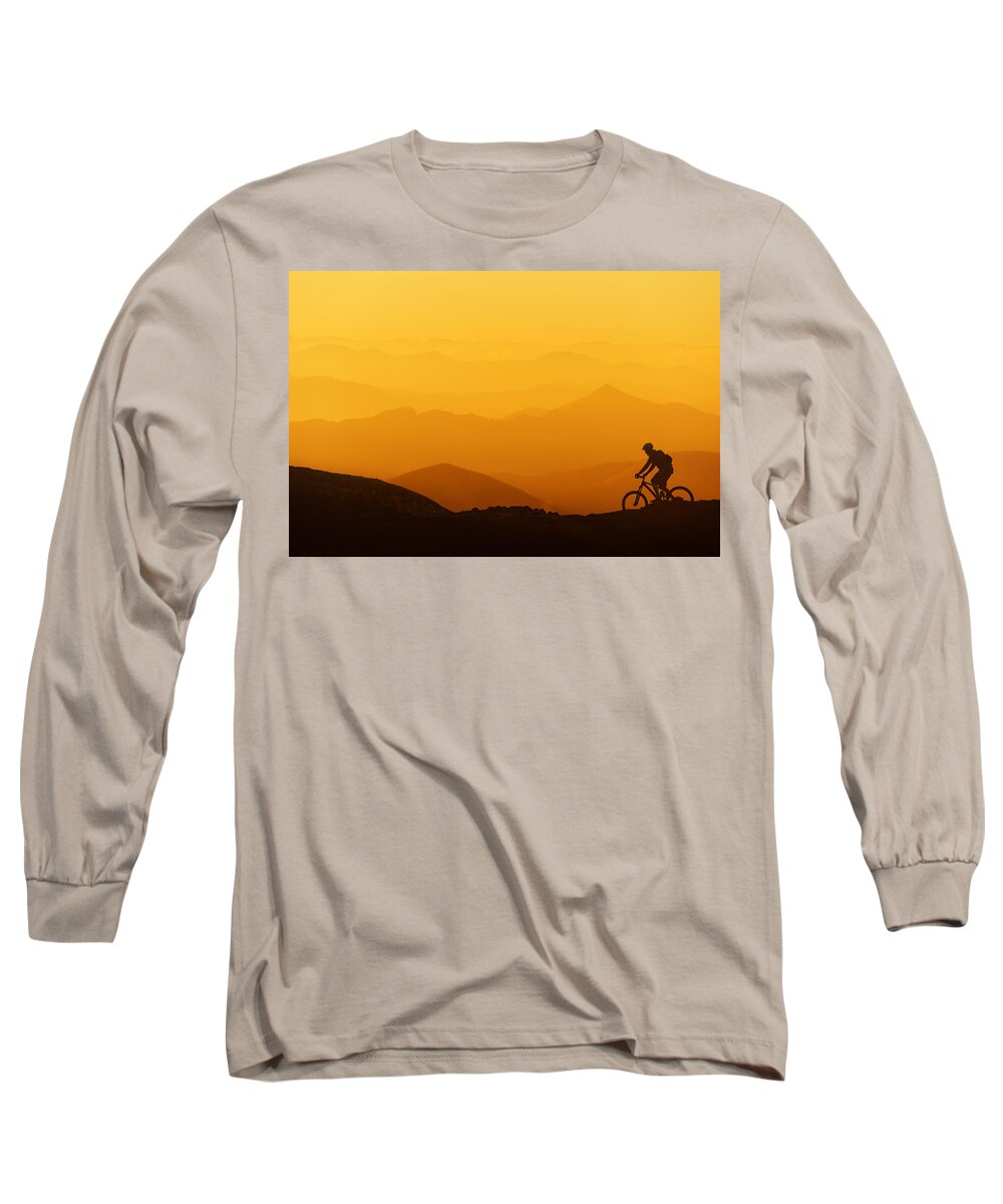 Biker Long Sleeve T-Shirt featuring the photograph Biker Riding On Mountain Silhouettes Background by Mikel Martinez de Osaba