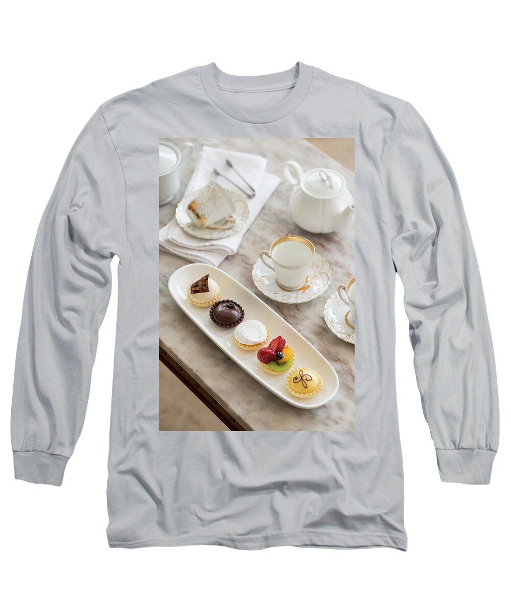 Ip_11426302 Long Sleeve T-Shirt featuring the photograph A Table Laid With Petit Fours And Tea by Ashley Mackevicius