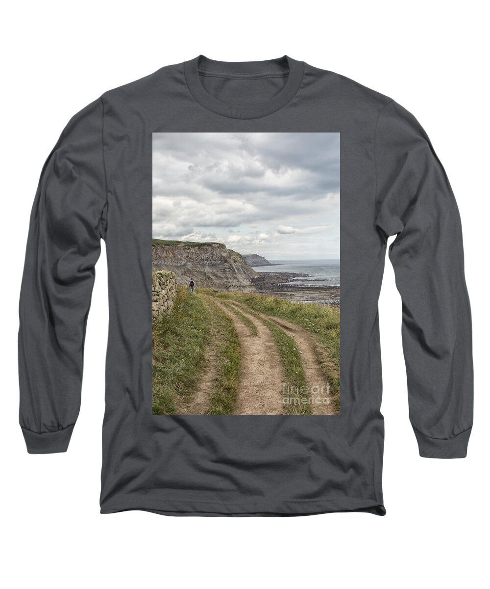 Cleveland Way Long Sleeve T-Shirt featuring the photograph Male hiker on coastal path in North Yorkshire by Patricia Hofmeester