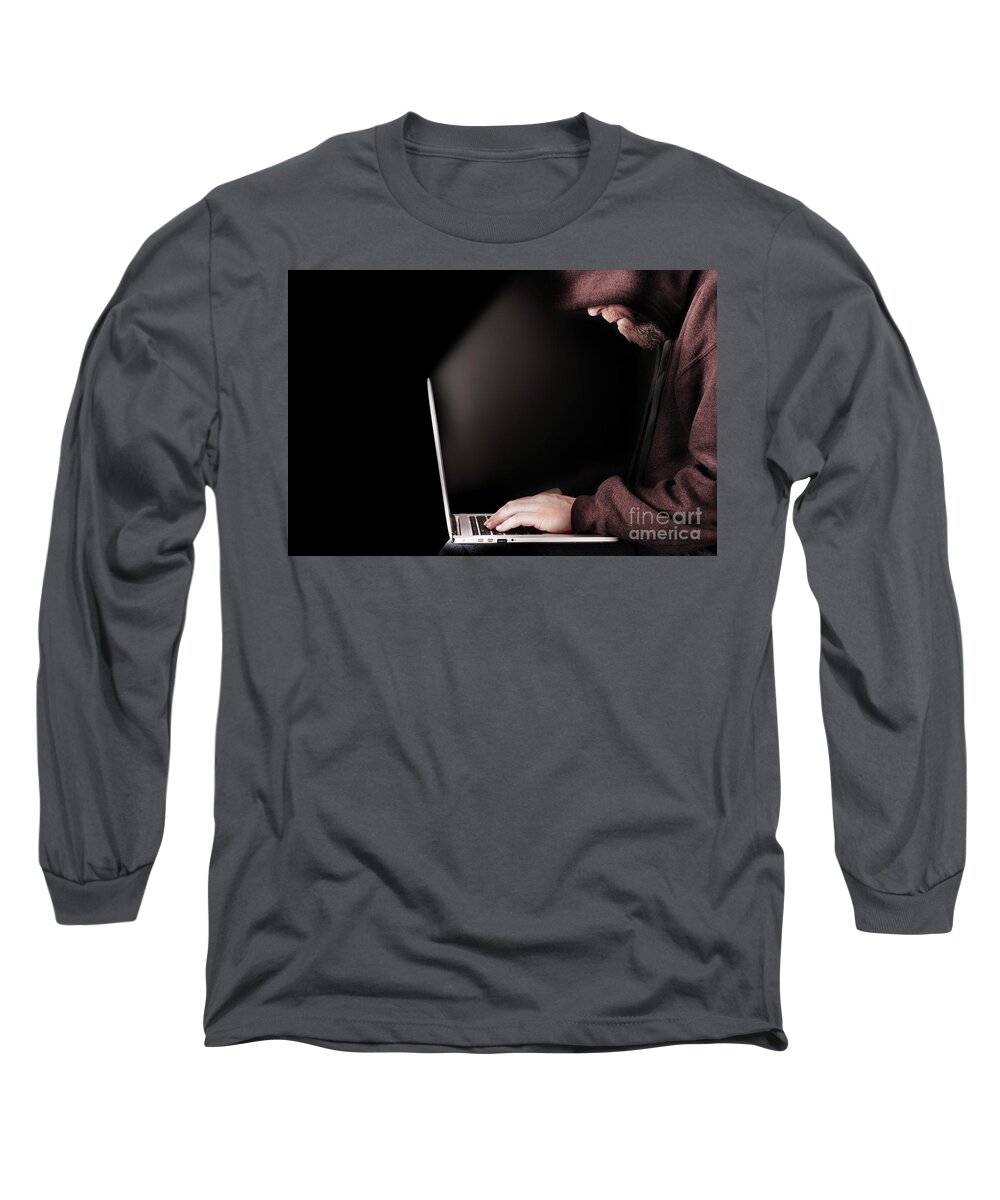 Computer Long Sleeve T-Shirt featuring the photograph Hooded computer hacker using laptop by Simon Bratt