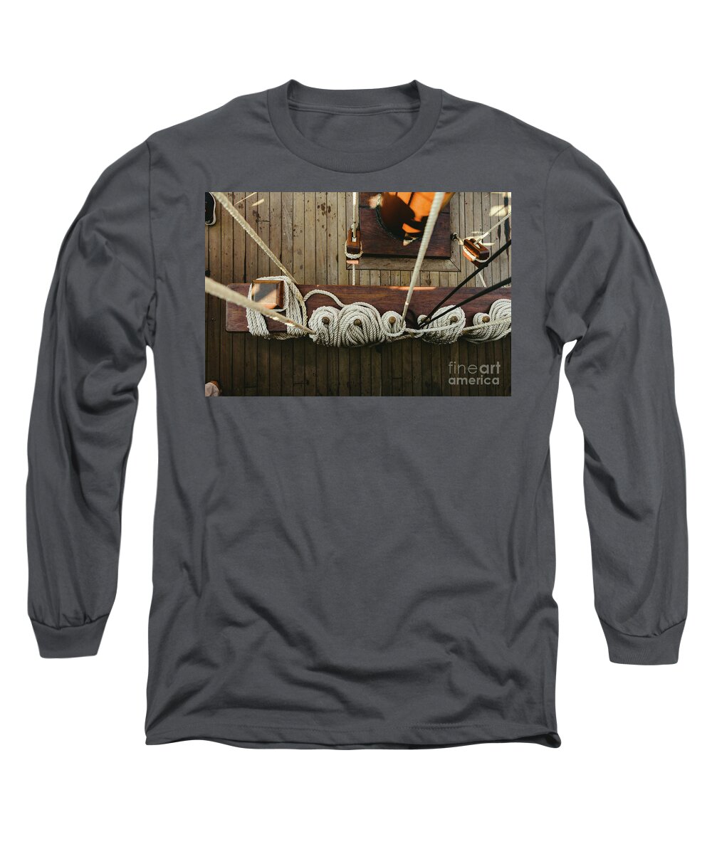 Abstract Long Sleeve T-Shirt featuring the photograph Ropes to hold the sails of an old sailboat rolled. by Joaquin Corbalan