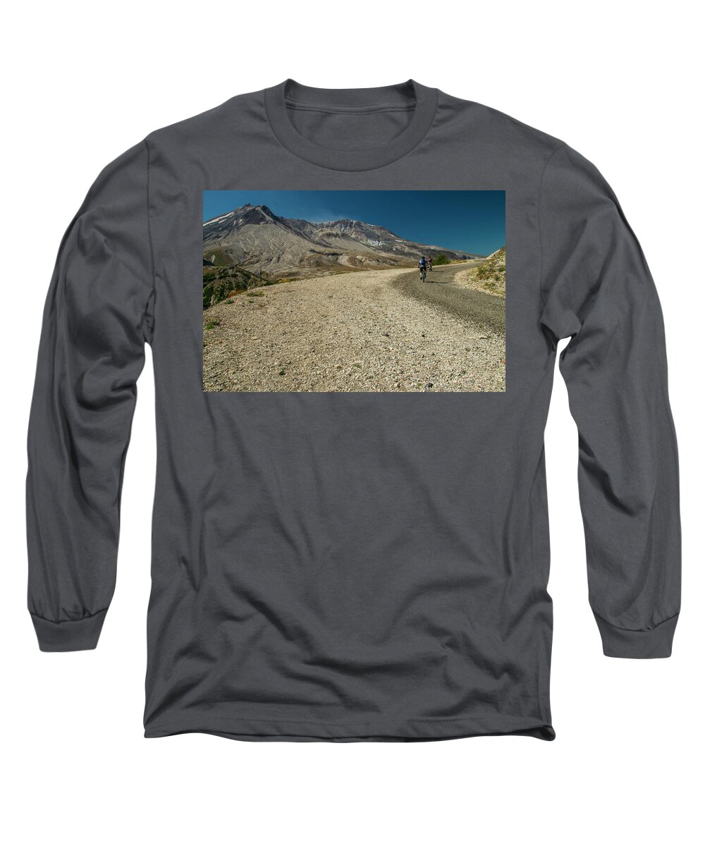 Two Bicyclists On The Windy Ridge Road Pass Directly In Front Of Mt. St. Helens' Blast Zone. Long Sleeve T-Shirt featuring the photograph Take a Ride on the Wild Side by Doug Scrima