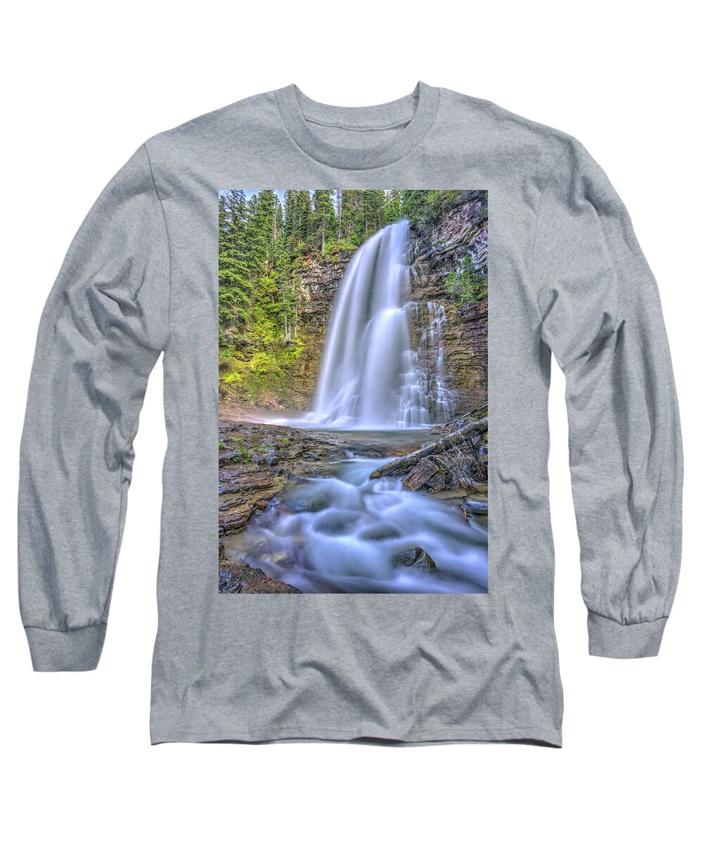 The Powerful And Towering Cascading Virginia Falls At Glacier Na Long Sleeve T-Shirt featuring the photograph Simplest things can turn out to be amazing by Carolyn Hall