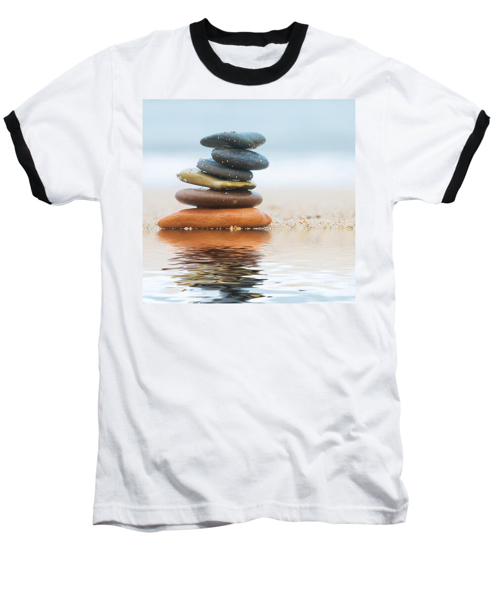 Stone Baseball T-Shirt featuring the photograph Stack of beach stones on sand #2 by Michal Bednarek