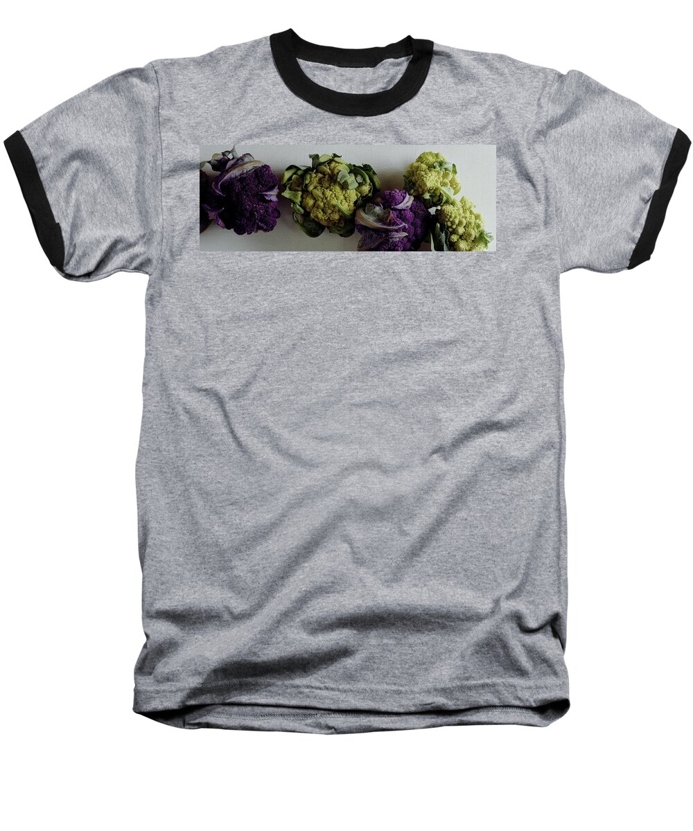 Food Baseball T-Shirt featuring the photograph A Group Of Cauliflower Heads by Romulo Yanes