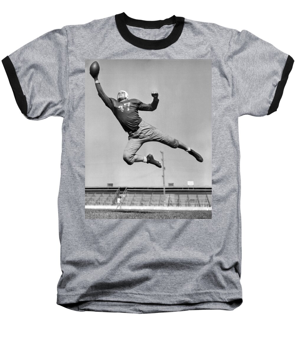 1945 Baseball T-Shirt featuring the photograph Football Player Catching Pass by Underwood Archives
