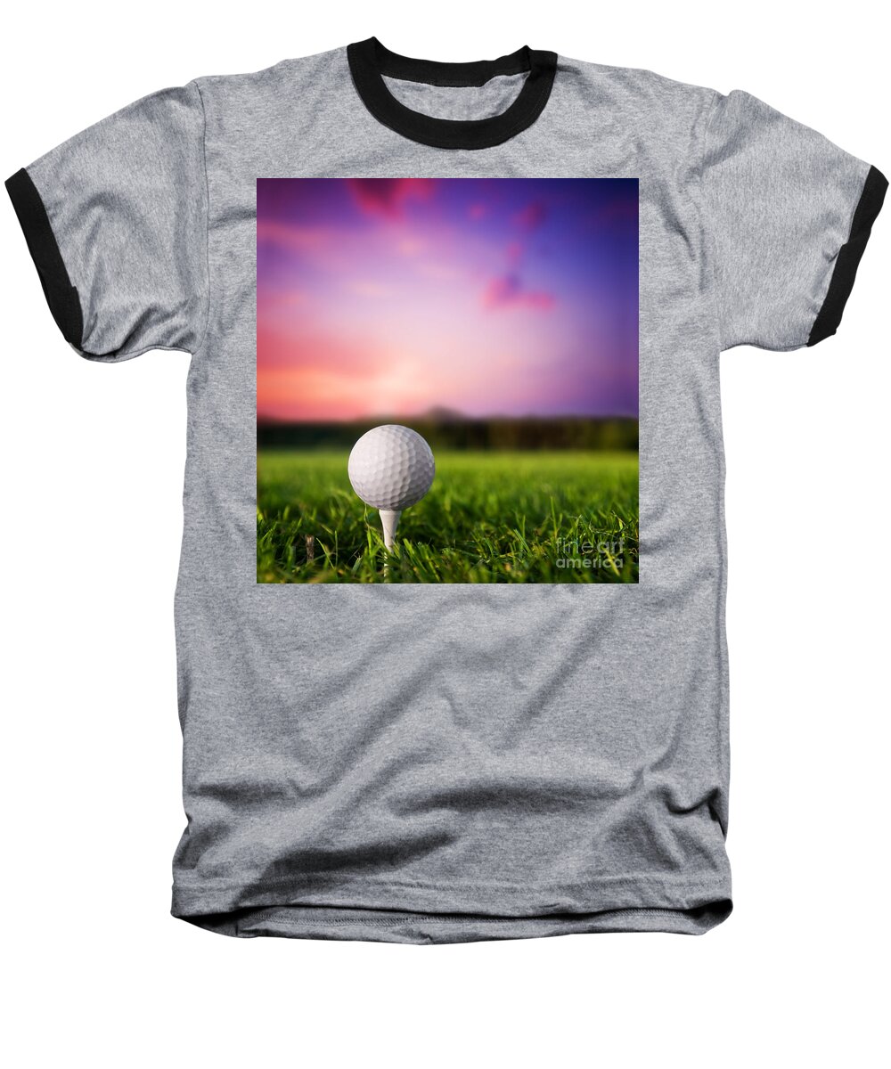 Sports Baseball T-Shirt featuring the photograph Golf ball on tee at sunset by Michal Bednarek