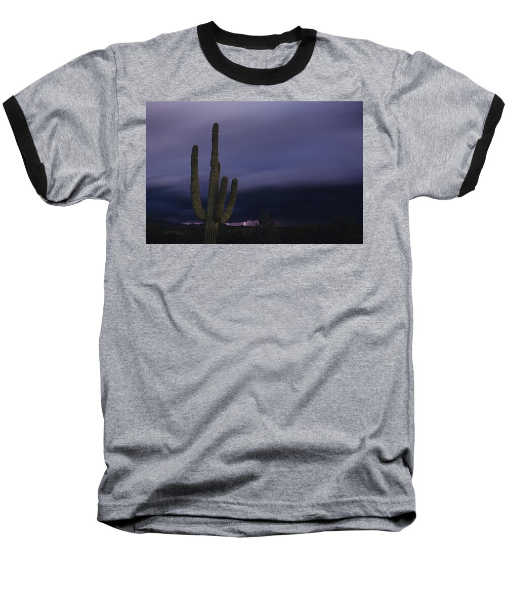 American Southwest Baseball T-Shirt featuring the photograph Saguaro cactus sunset at dusk with lightning Arizona State USA by Jim Corwin