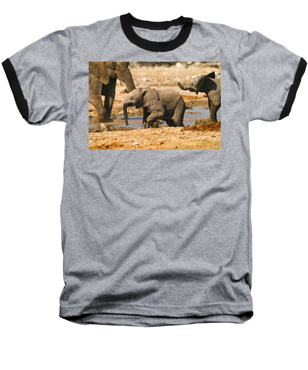A Baby Elephants Play Baseball T-Shirt featuring the photograph Chase you by Alistair Lyne