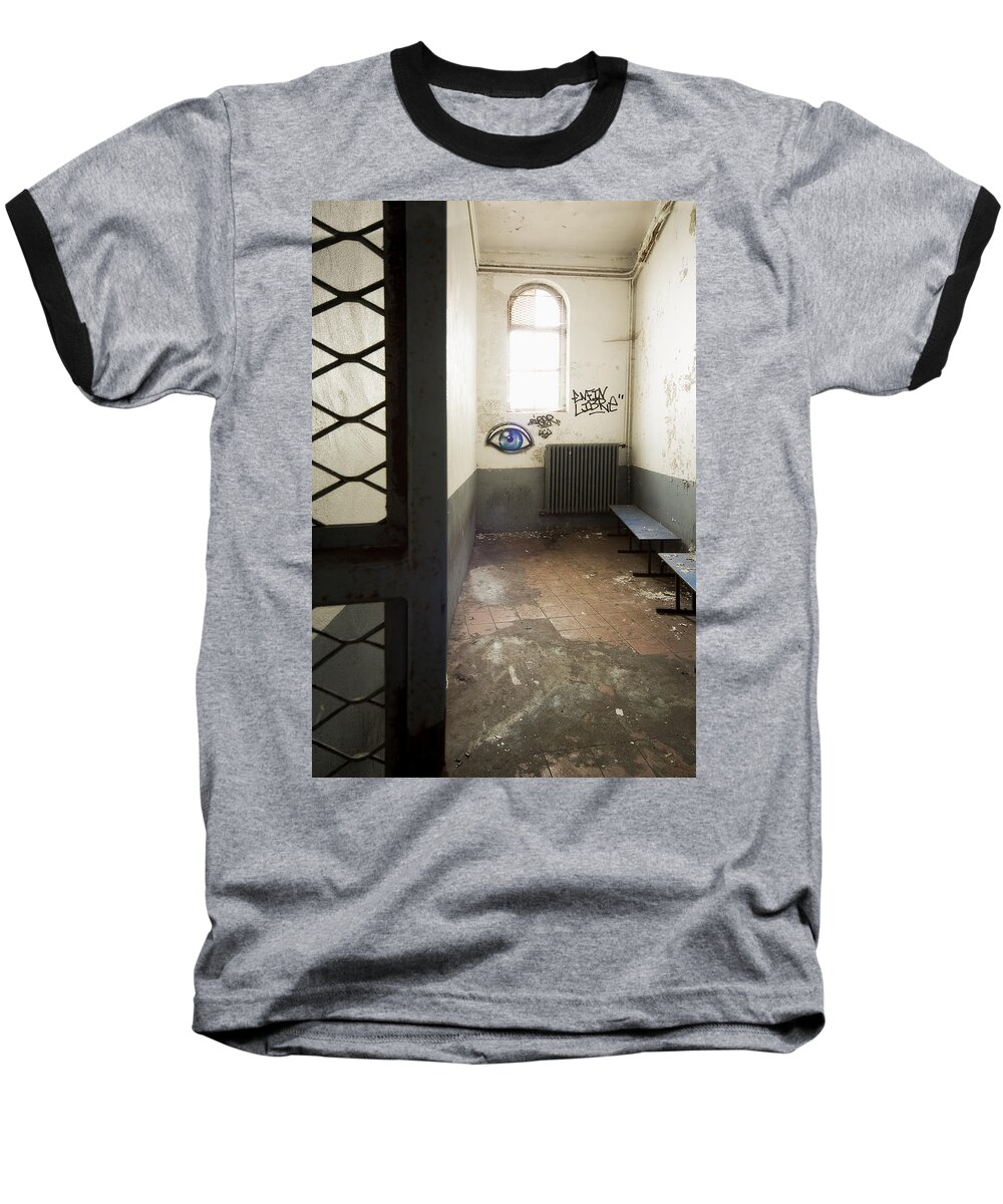 France Baseball T-Shirt featuring the photograph Abandoned prison cell with grafitti of eye on wall by Dirk Ercken