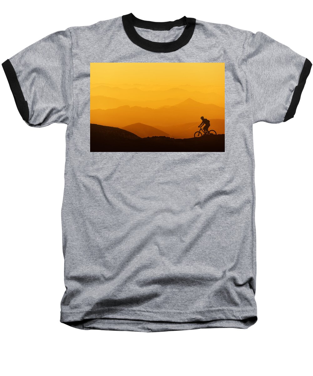 Biker Baseball T-Shirt featuring the photograph Biker Riding On Mountain Silhouettes Background by Mikel Martinez de Osaba