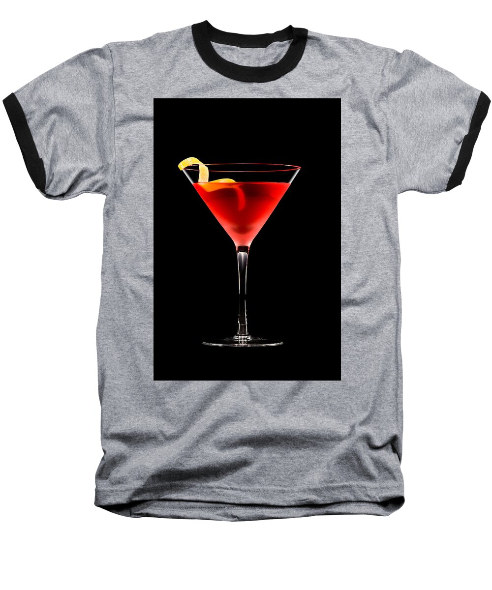 Alcohol Baseball T-Shirt featuring the photograph Cosmopolitan cocktail in front of a black background by U Schade