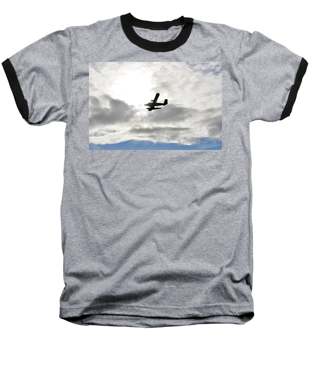 A Seaplane Is Silhouetted Against Clouds Spotlit By The Translucent Glow Of Morning Sun. Baseball T-Shirt featuring the photograph Escape by Climate Change VI - Sales