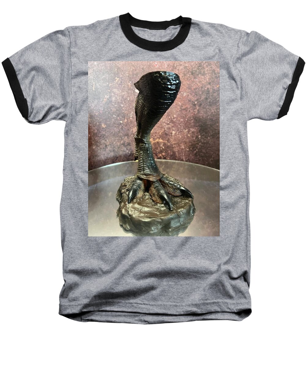 Scale Replica T Rex Foot Stepping In Mud From Jurassic Park Baseball T-Shirt featuring the sculpture Scale replica T Rex foot stepping in mud from Jurassic Park by Michael McKenzie