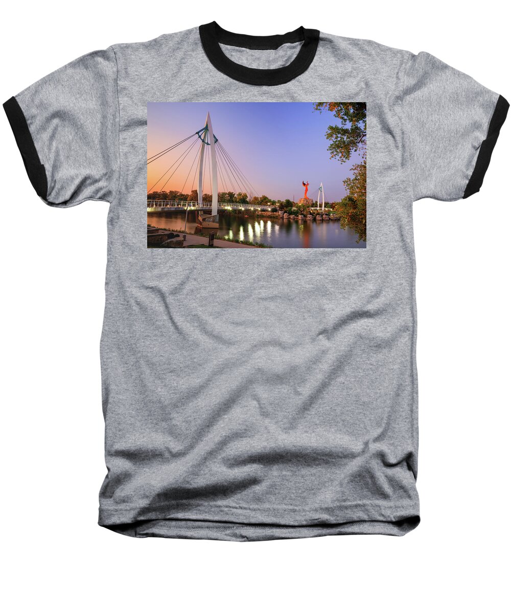Wichita Kansas Baseball T-Shirt featuring the photograph The Keeper Of The Plains And Suspension Bridges At Dusk - Wichita Kansas by Gregory Ballos