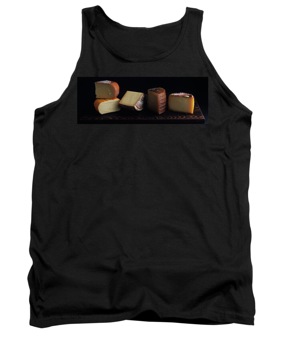 Dairy Tank Top featuring the photograph A Variety Of Cheese On A Cutting Board by Romulo Yanes