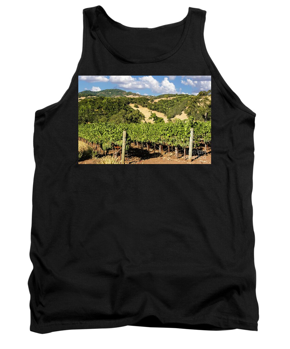 Clouds Tank Top featuring the photograph White puffy clouds over the Napa Valley hills full of wine grapes and lines and lines of vineyards. by Gunther Allen