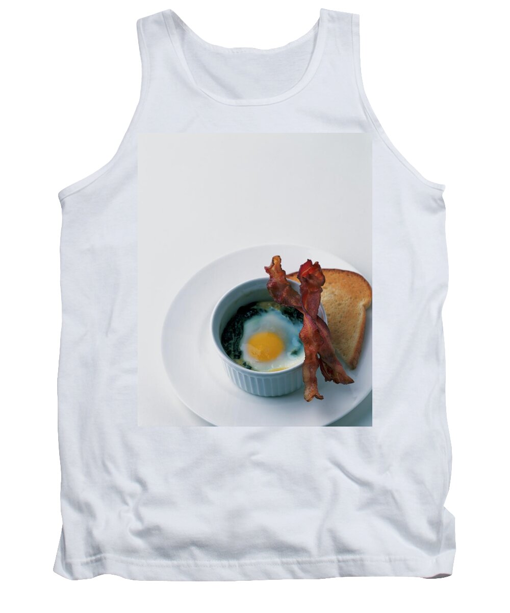 Cooking Tank Top featuring the photograph A Baked Egg With Spinach by Romulo Yanes