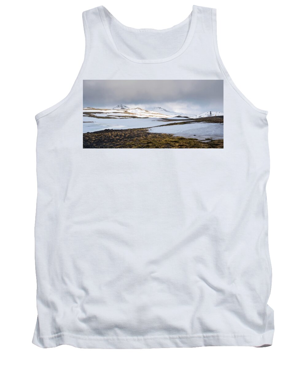 Iceland Tank Top featuring the photograph Icelandic landscape with mountains and meadow land covered in snow. Iceland #1 by Michalakis Ppalis