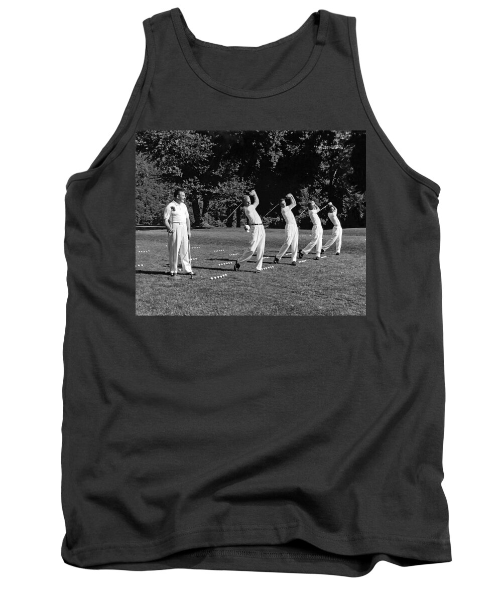 1950s Tank Top featuring the photograph A Golf Driving Demonstration. by Underwood Archives