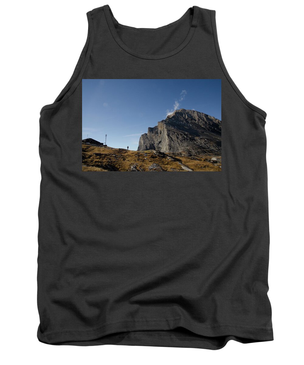 Figure Tank Top featuring the photograph Figure in the distance with mountains by Erik Burg