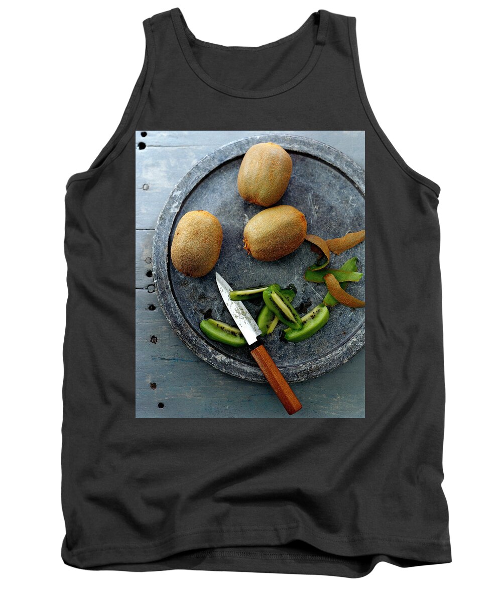 Foodstudio Shotstill Lifeplatetablewareknifekiwi Fruitfruithealthy Eatingsliceview From Above #condenastgourmetphotograph November 1st 2006 Tank Top featuring the photograph A Plate Of Kiwifuit by Romulo Yanes
