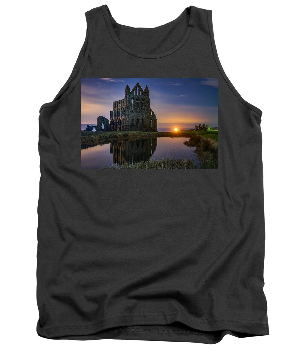 Whitby Tank Top featuring the photograph The historic Whitby abbey in England seen on a beautiful night. by George Afostovremea