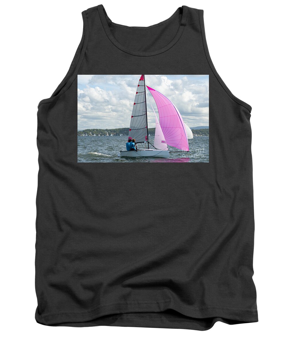 Csne35 Tank Top featuring the photograph Two school kids sailing small sailboat with a fully deployed vibrant pink spinnaker. by Geoff Childs