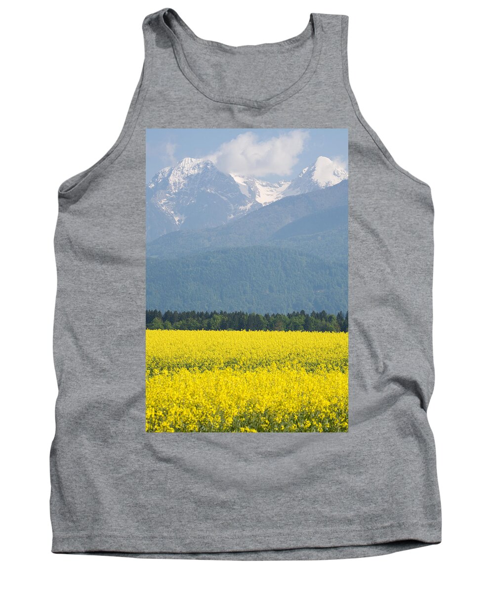 Brnik Tank Top featuring the photograph rapeseed field in Brnik with Kamnik Alps in the background #4 by Ian Middleton