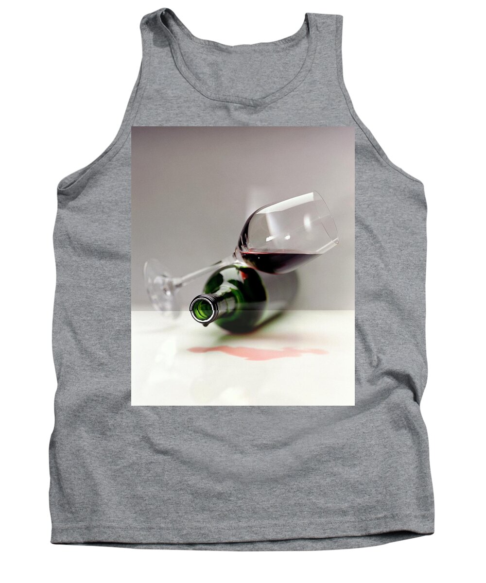 Beverage Tank Top featuring the photograph A Wine Bottle And A Glass Of Wine by Romulo Yanes