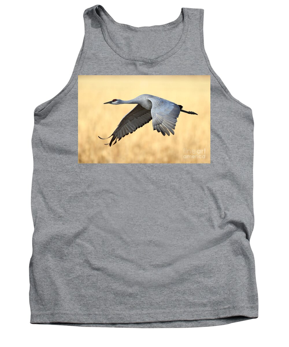Crane Tank Top featuring the photograph Crane over golden field by Bryan Keil
