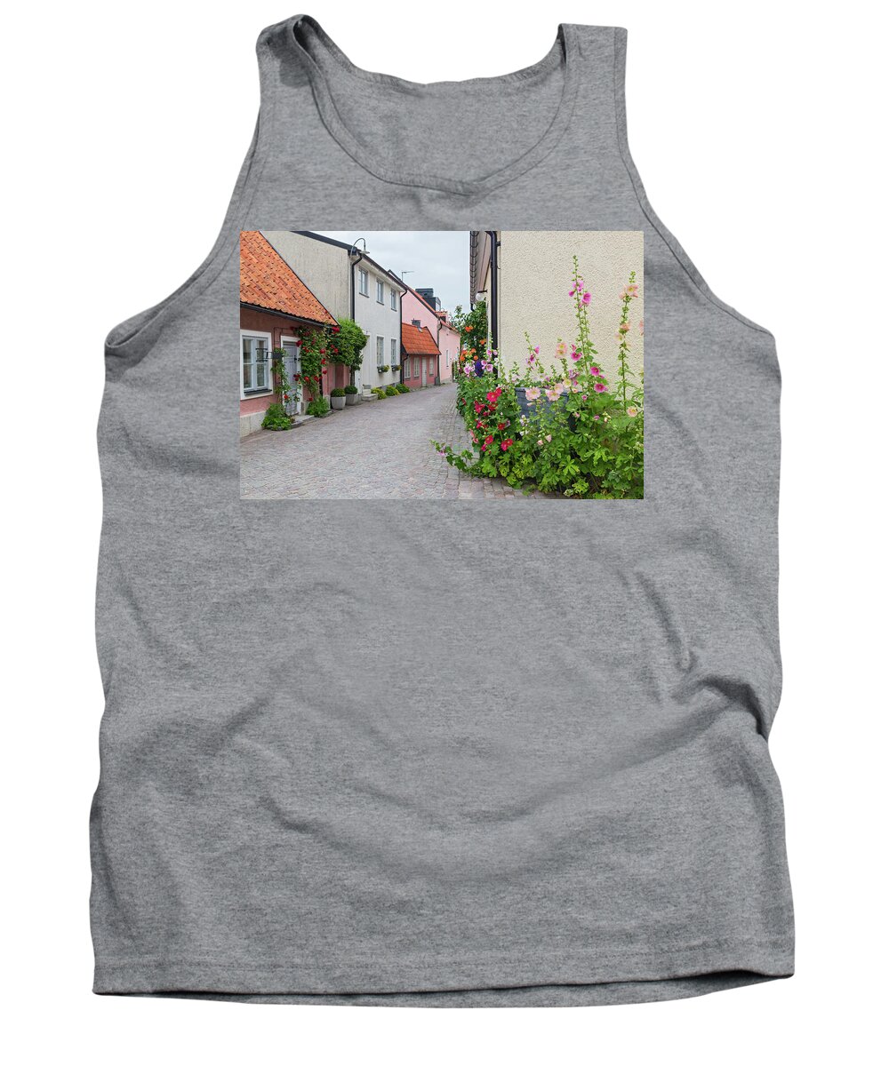 Street Tank Top featuring the photograph Cozy street with blooming mallows and roses by GoodMood Art