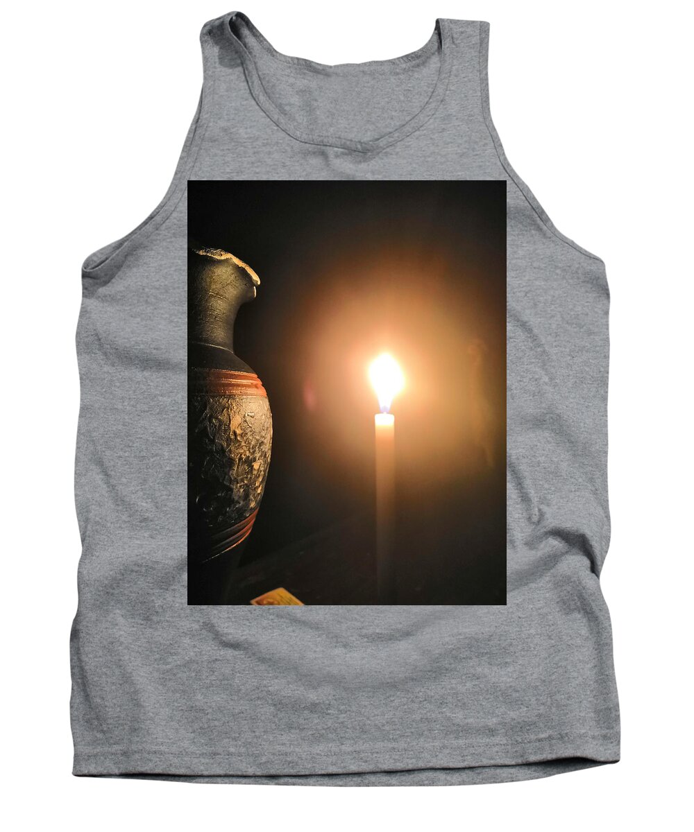 Candle Light Tank Top featuring the photograph Light in the dark by Ian Batanda