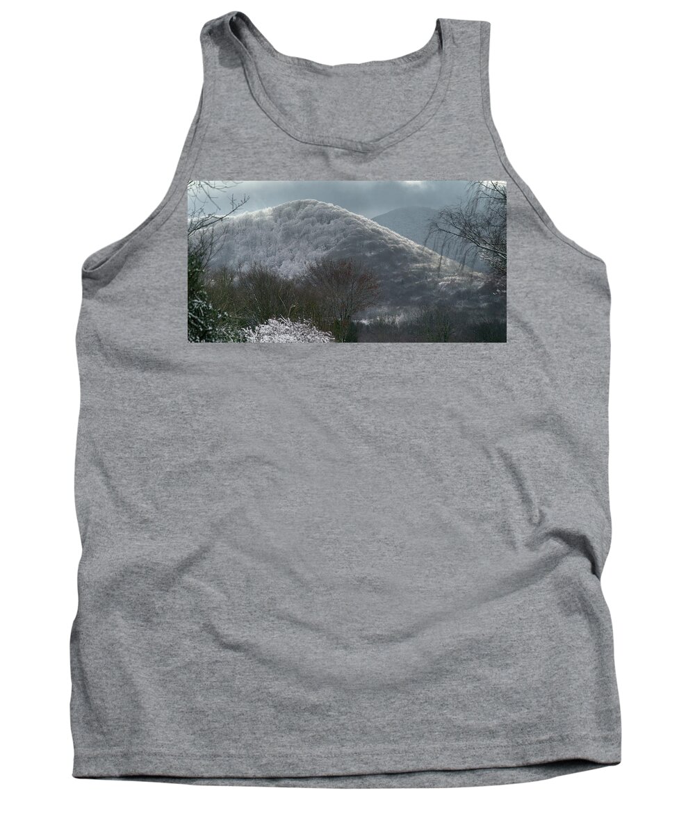 Autumn Tank Top featuring the photograph Light games between clouds and snow on the volcano by Jean-Luc Farges
