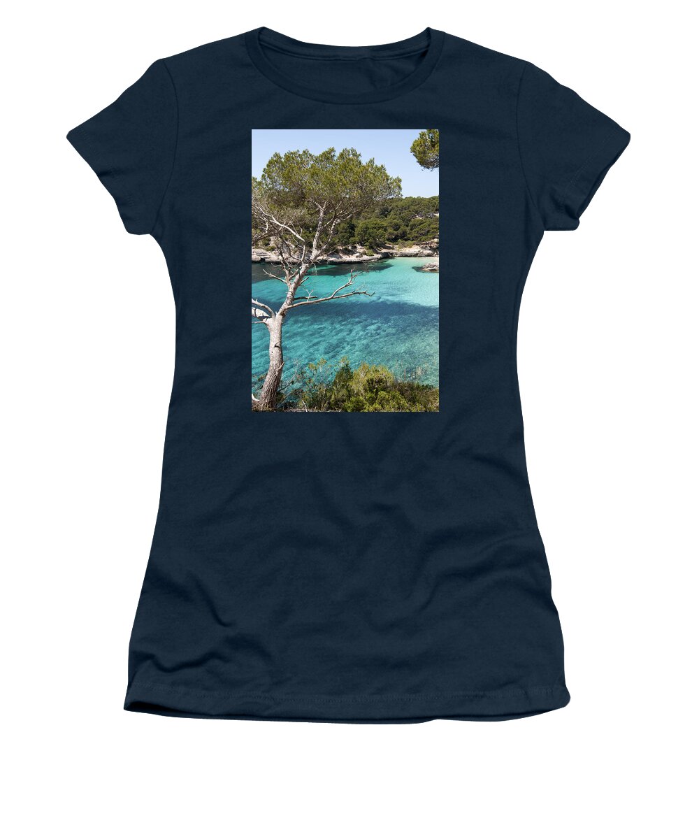 Blue Women's T-Shirt featuring the photograph Blue sea in Minorca Cala Mitjana beach in the north coast is a turquoise paradise with white sand by Pedro Cardona Llambias