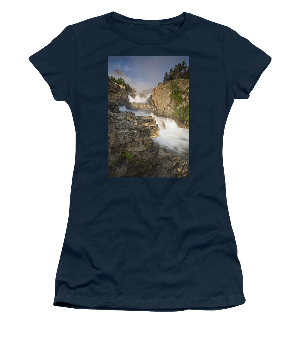 00439322 Women's T-Shirt featuring the photograph Swiftcurrent Falls And Mount Grinnell by Sebastian Kennerknecht